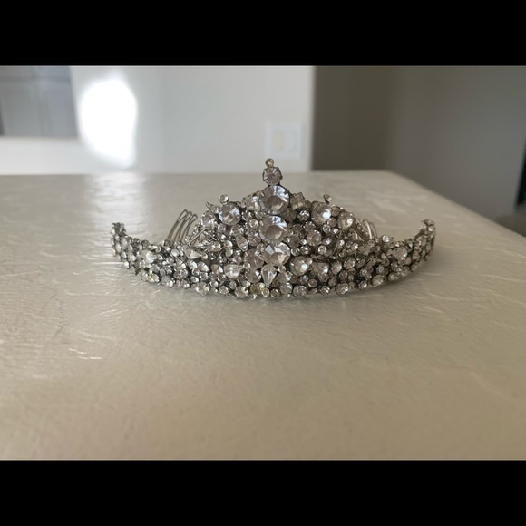 Wedding headpiece filled with Swarovski crystals .